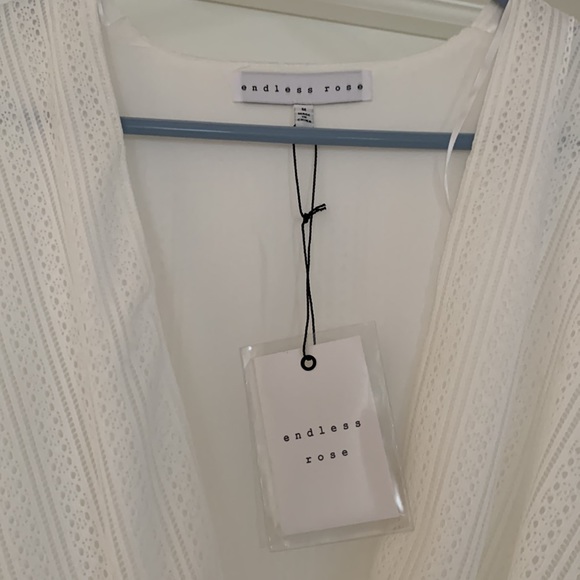 White jumper shorts one piece. Endless rose from Revolve. Never warn with tags. - Picture 2 of 4